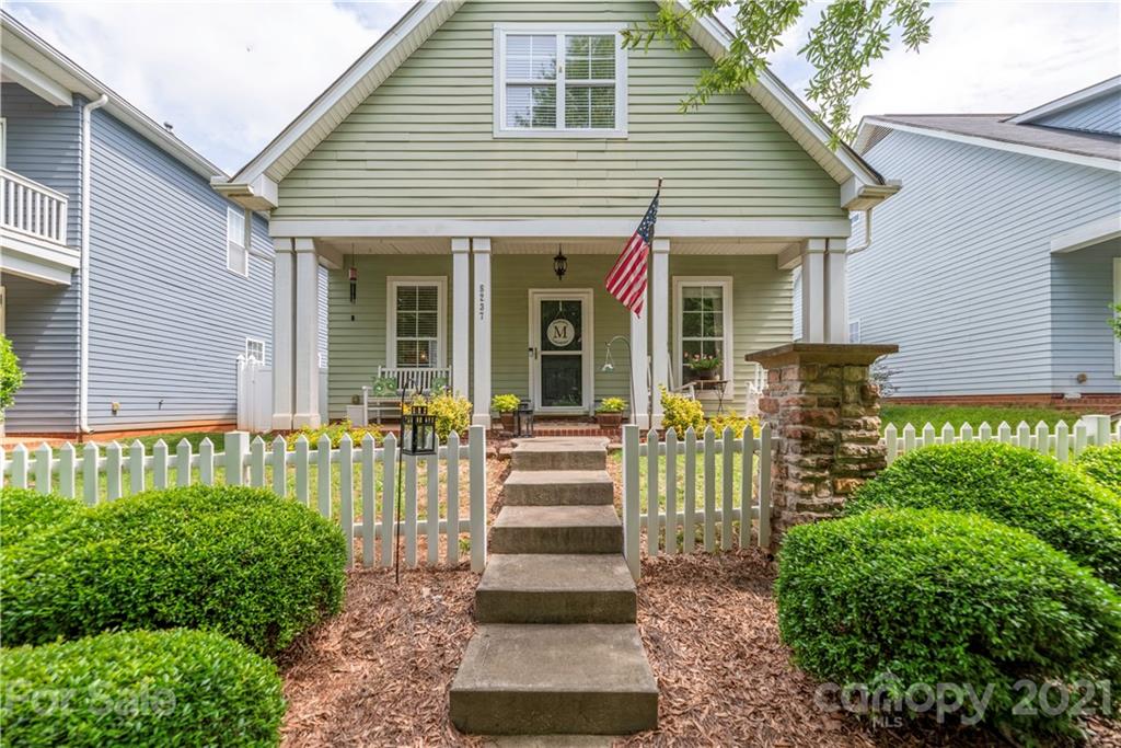 8237 Bud Henderson Road Huntersville, NC 28078 - Photo 2 of 25 a front view of a house with a porch