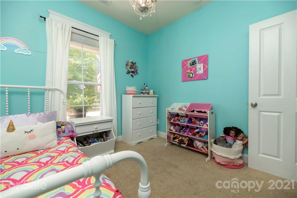 8237 Bud Henderson Road Huntersville, NC 28078 - Photo 19 of 25 a bedroom with a bed and a window