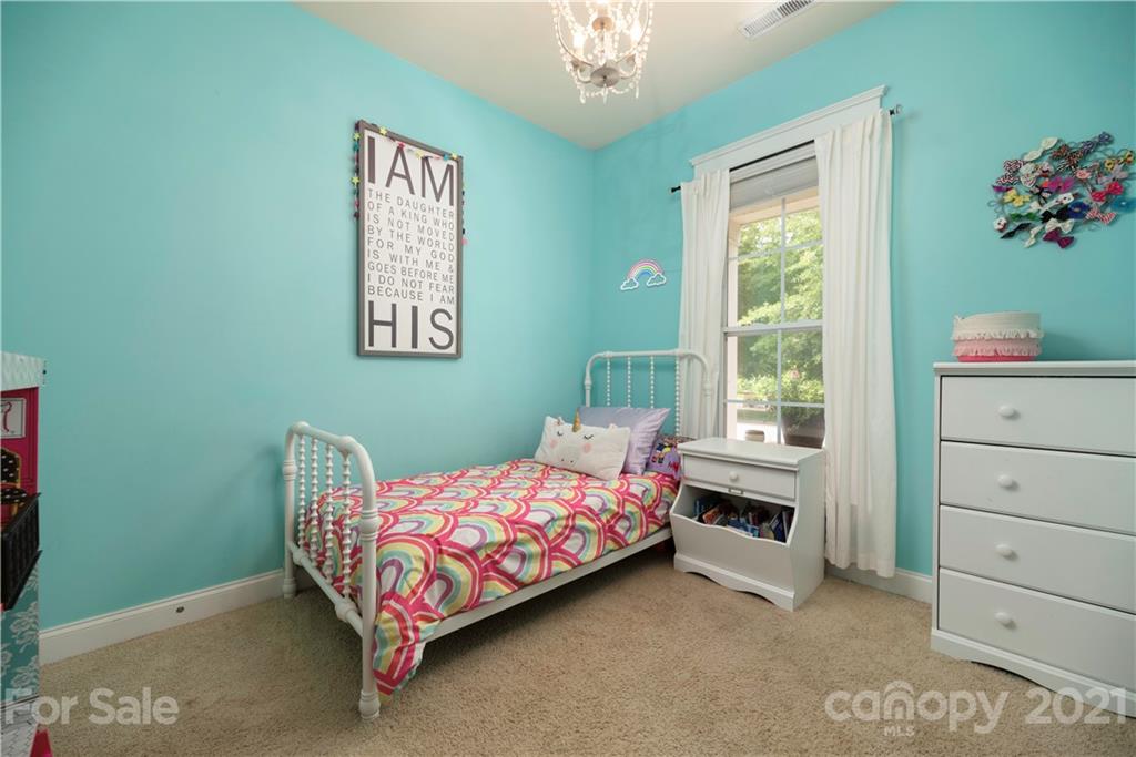 8237 Bud Henderson Road Huntersville, NC 28078 - Photo 20 of 25 a bedroom with a bed and a window