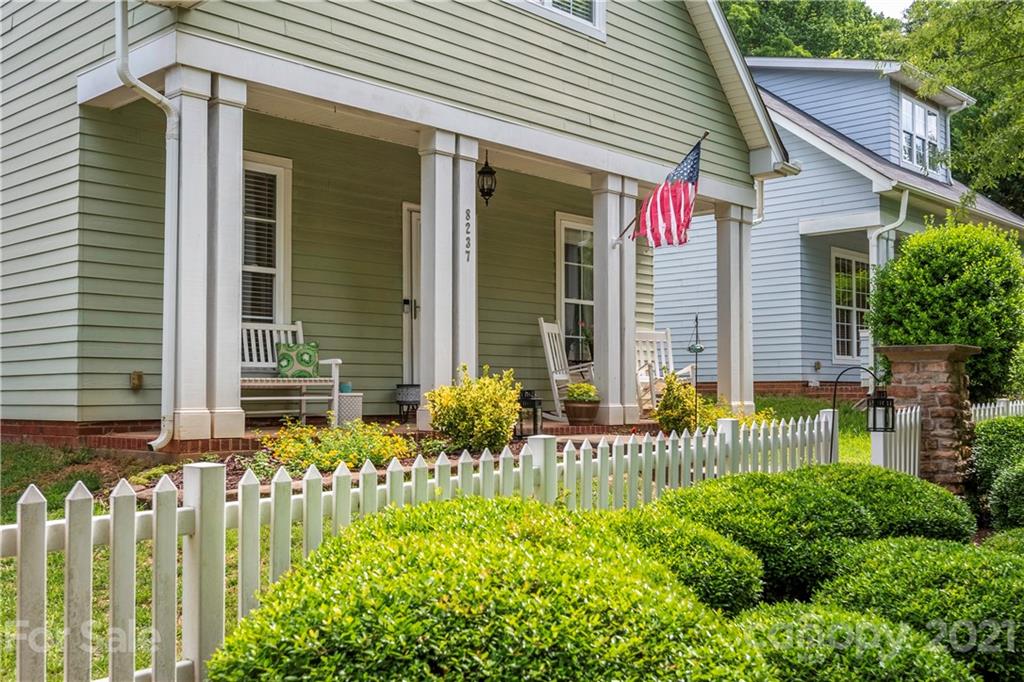 8237 Bud Henderson Road Huntersville, NC 28078 - Photo 21 of 25 a front view of a house with a garden