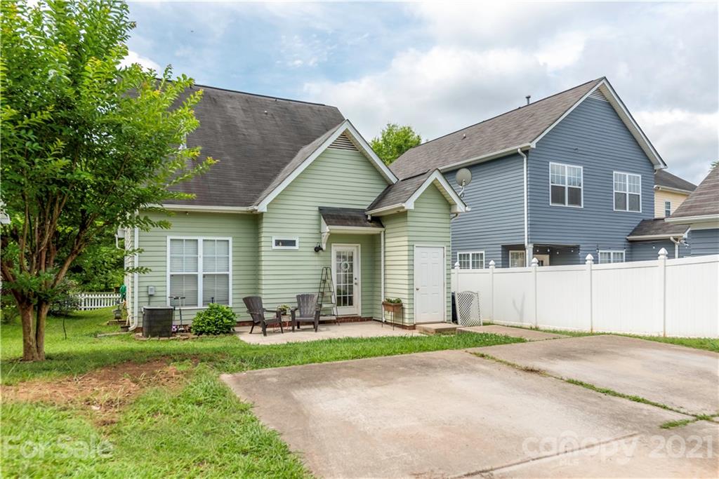 8237 Bud Henderson Road Huntersville, NC 28078 - Photo 25 of 25 a front view of a house with a yard and trees