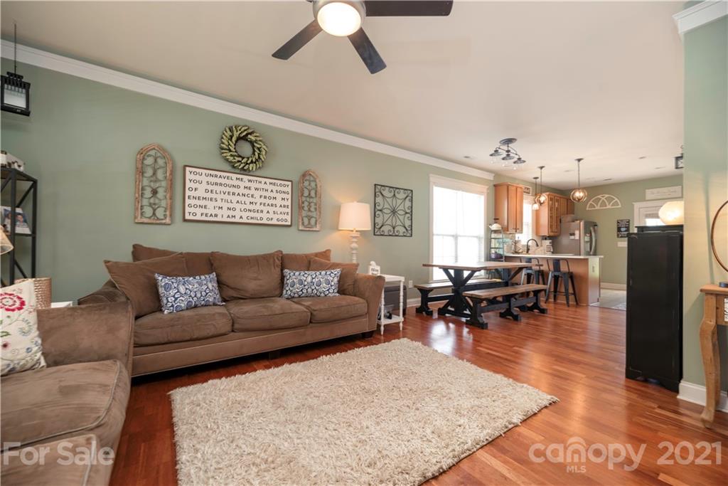 8237 Bud Henderson Road Huntersville, NC 28078 - Photo 10 of 25 a living room with furniture and wooden floor