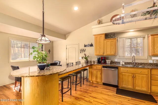 a kitchen with lots of counter top space and dining table