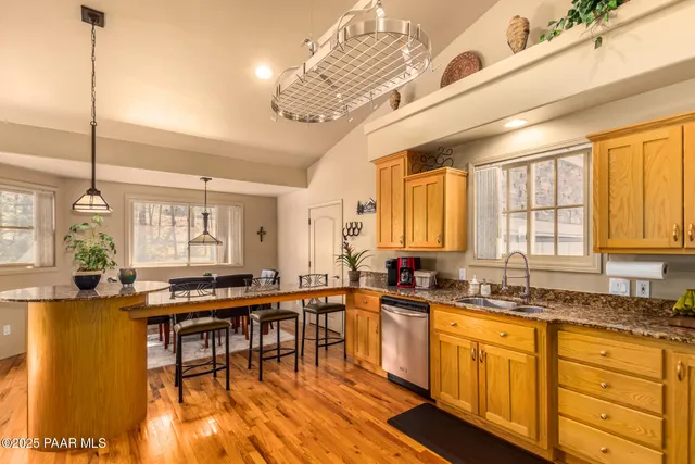 a large kitchen with lots of counter space and a sink