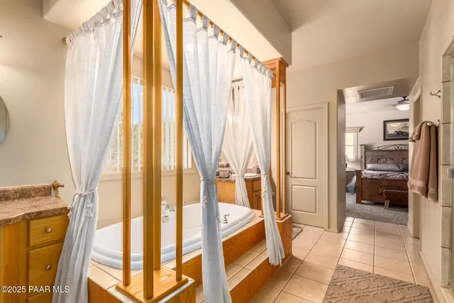 a bathroom with a tub and shower