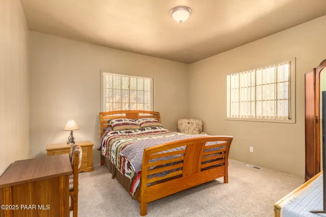 a bedroom with a bed and a cabinets