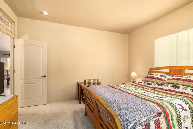 a bedroom with a bed and a cabinets