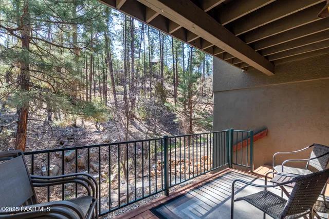 a view of balcony with furniture