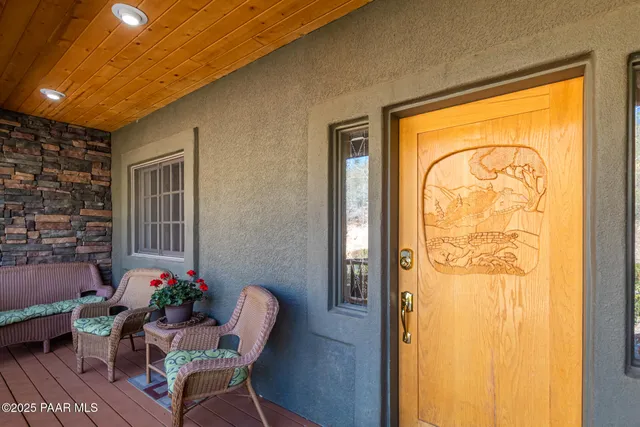 a room with furniture and a potted plant