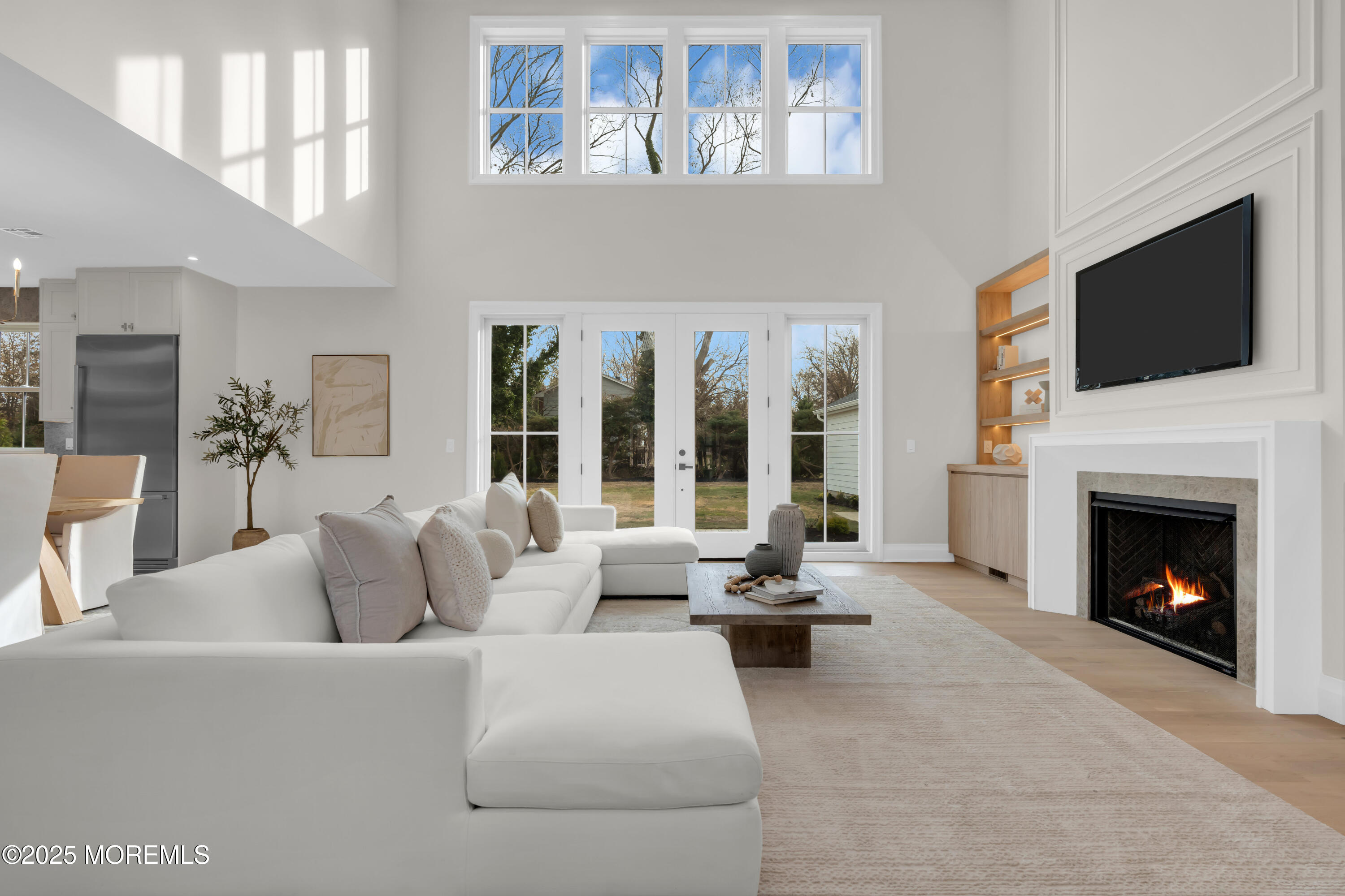 69 Winding Way Little Silver, NJ 07739 - Photo 19 of 99 a living room with furniture fireplace and flat screen tv