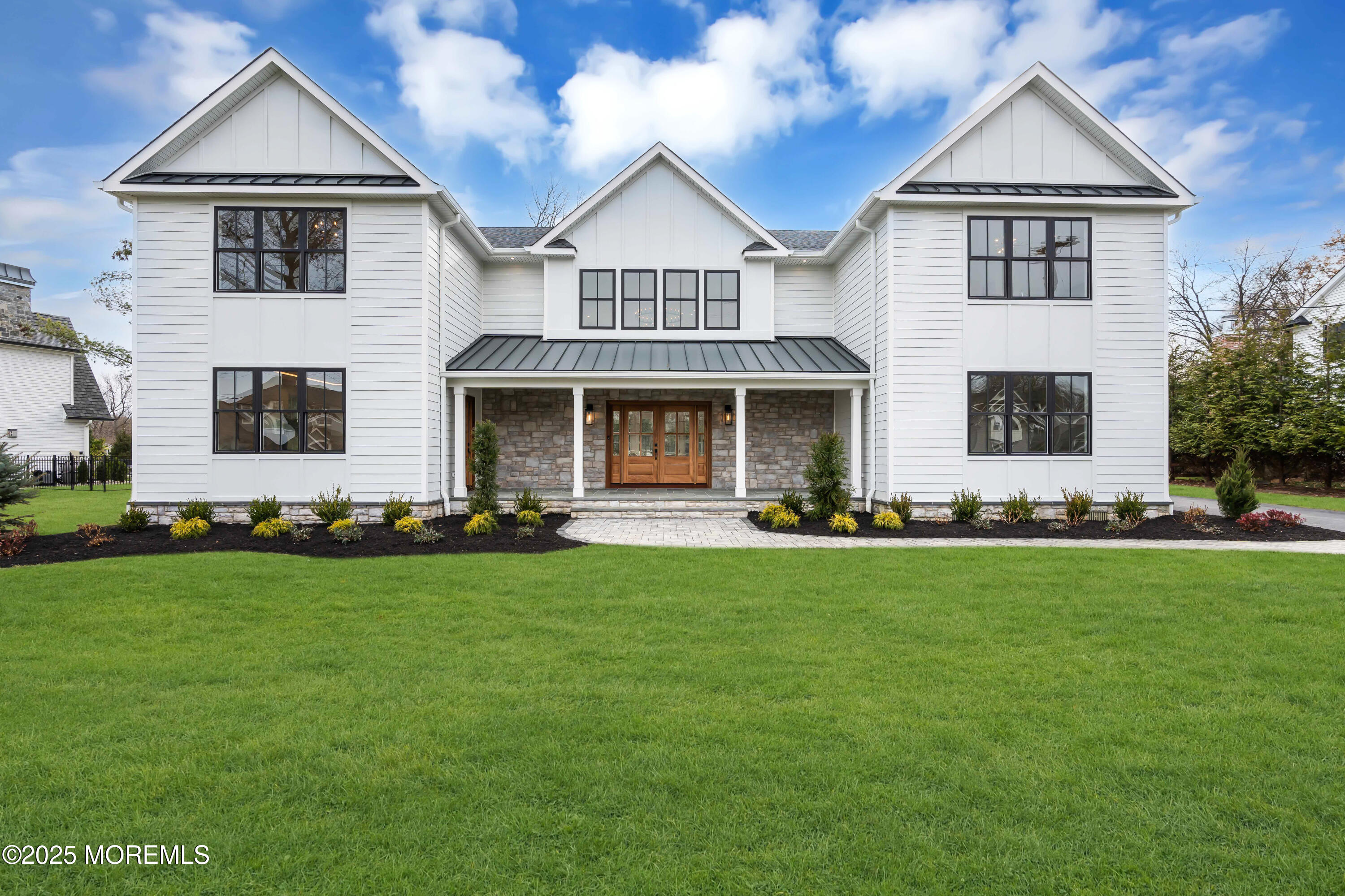 69 Winding Way Little Silver, NJ 07739 - Photo 3 of 99 a front view of a house with a garden
