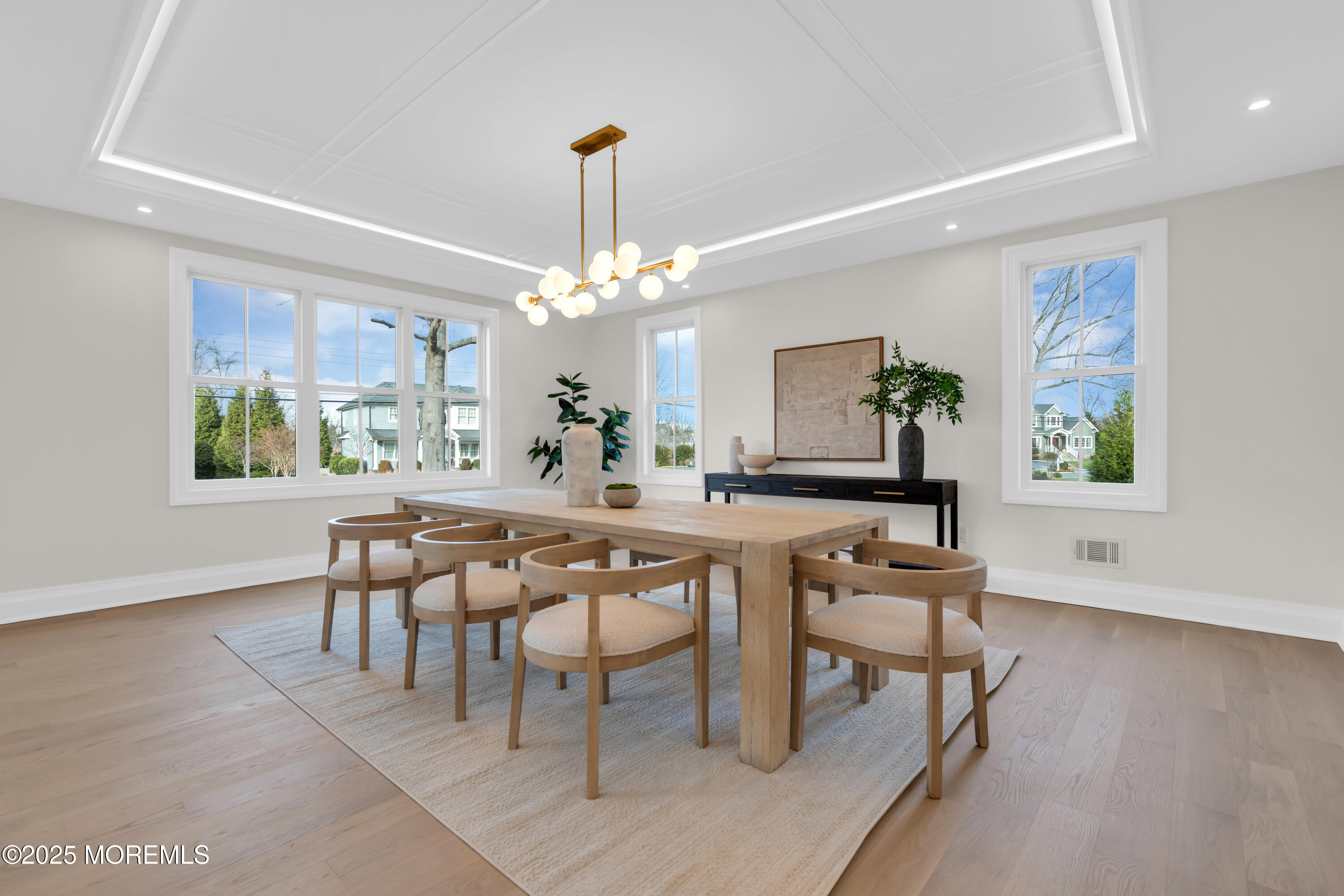 69 Winding Way Little Silver, NJ 07739 - Photo 38 of 99 a view of a dining room with furniture a chandelier and wooden floor
