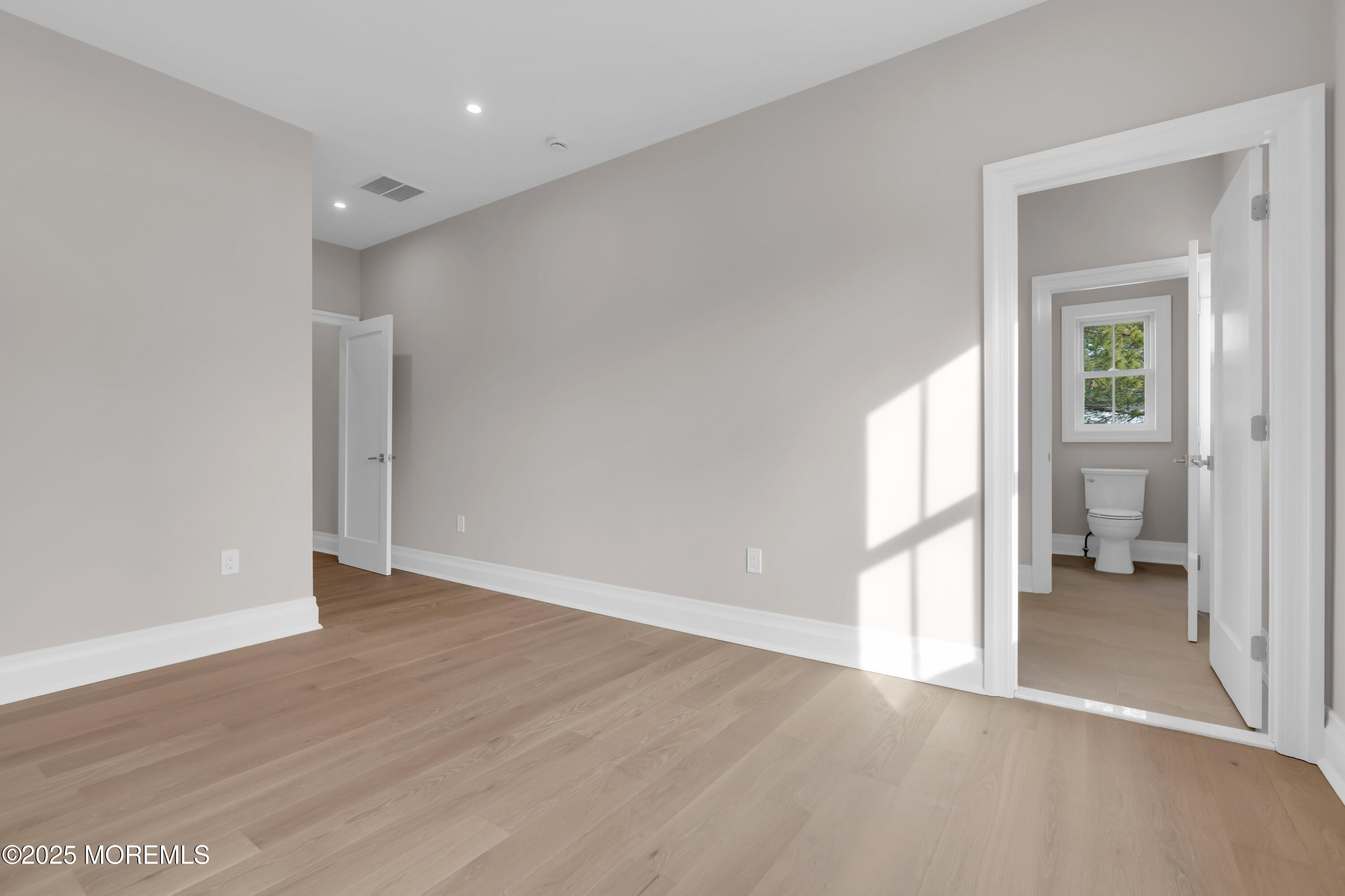 69 Winding Way Little Silver, NJ 07739 - Photo 82 of 99 a view of a room with wooden floor and a bathroom