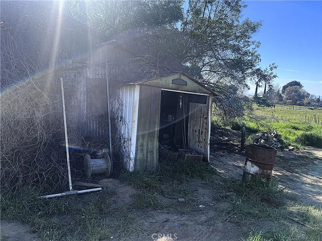 a view of an outdoor space with yard from a seating space