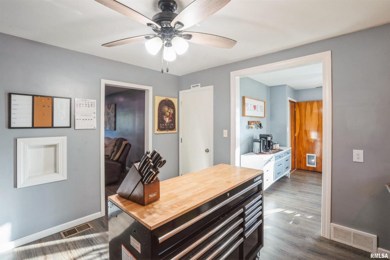 824 9th Avenue Fulton, IL 61252 - Photo 12 of 22 a view of a dining room with furniture and wooden floor