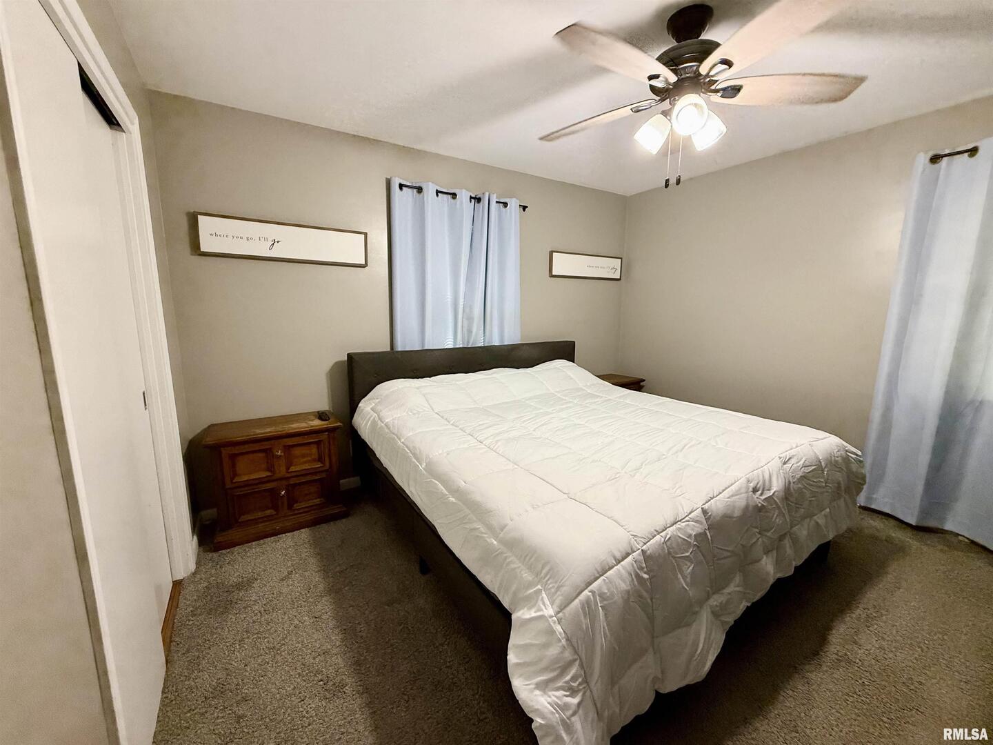 824 9th Avenue Fulton, IL 61252 - Photo 16 of 22 a bedroom with a bed and a chandelier