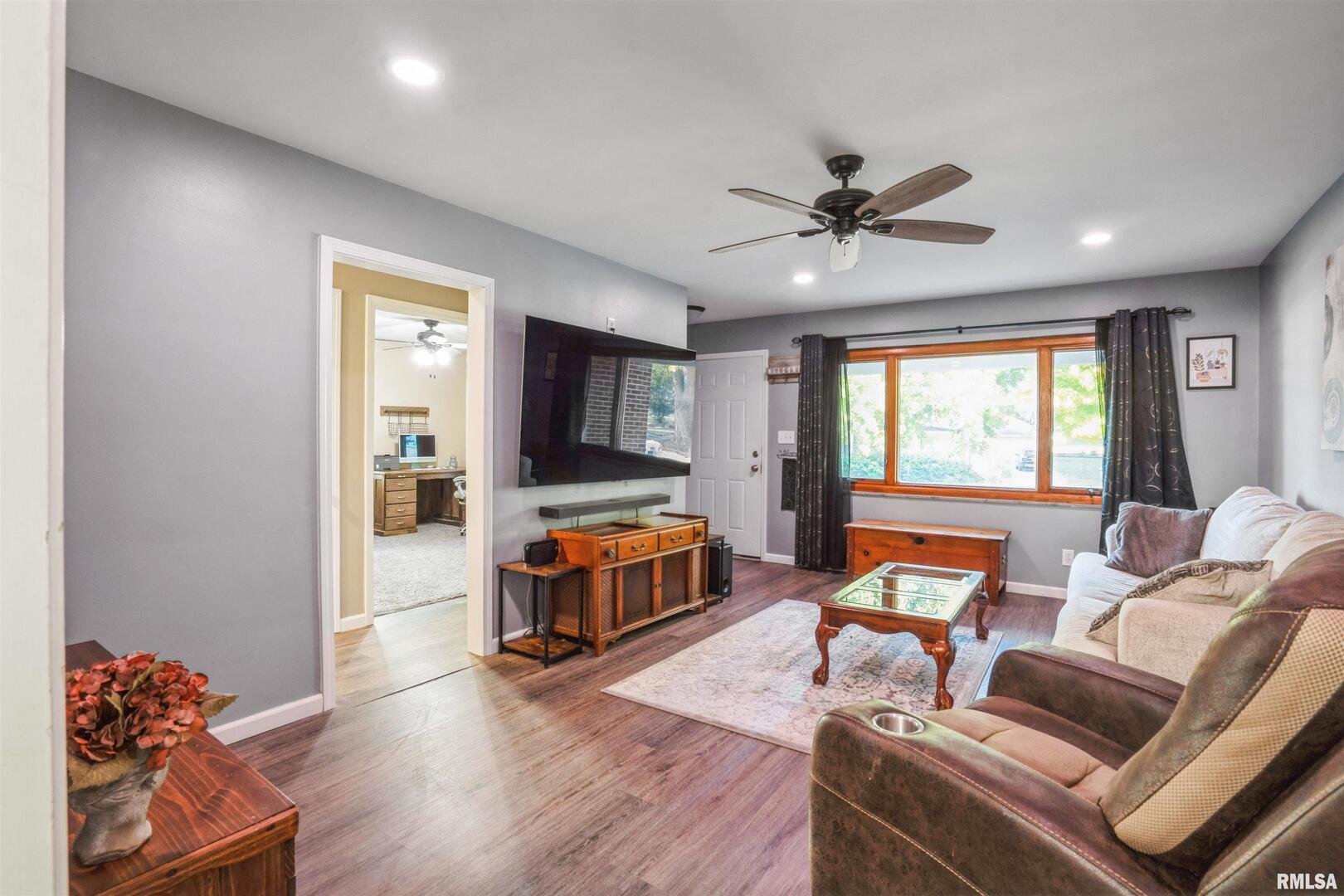 824 9th Avenue Fulton, IL 61252 - Photo 4 of 22 a living room with furniture and a flat screen tv