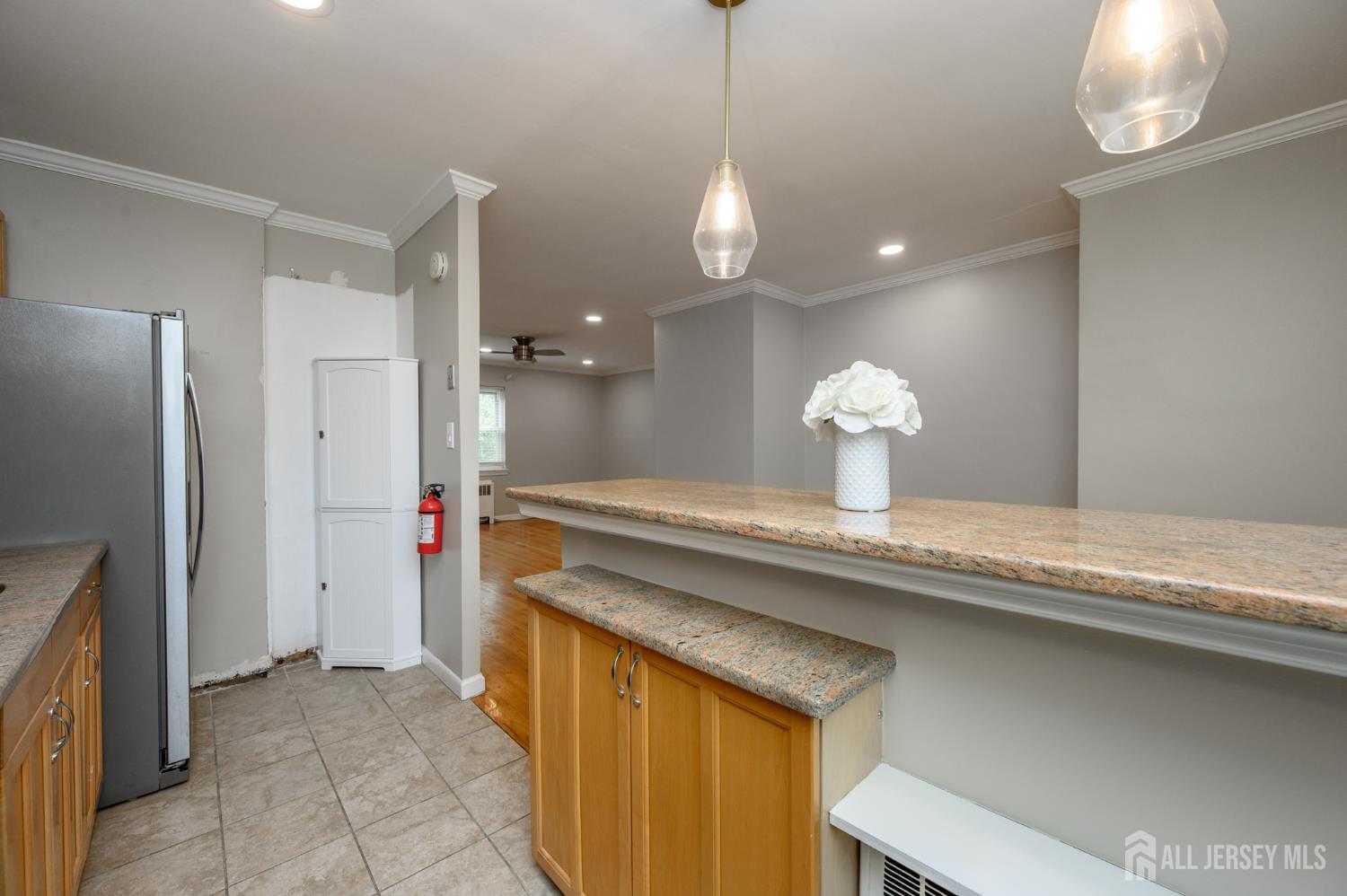 243 Johnson Avenue, Unit L5 Hackensack, NJ 07601 - Photo 12 of 24 a kitchen with a sink and refrigerator