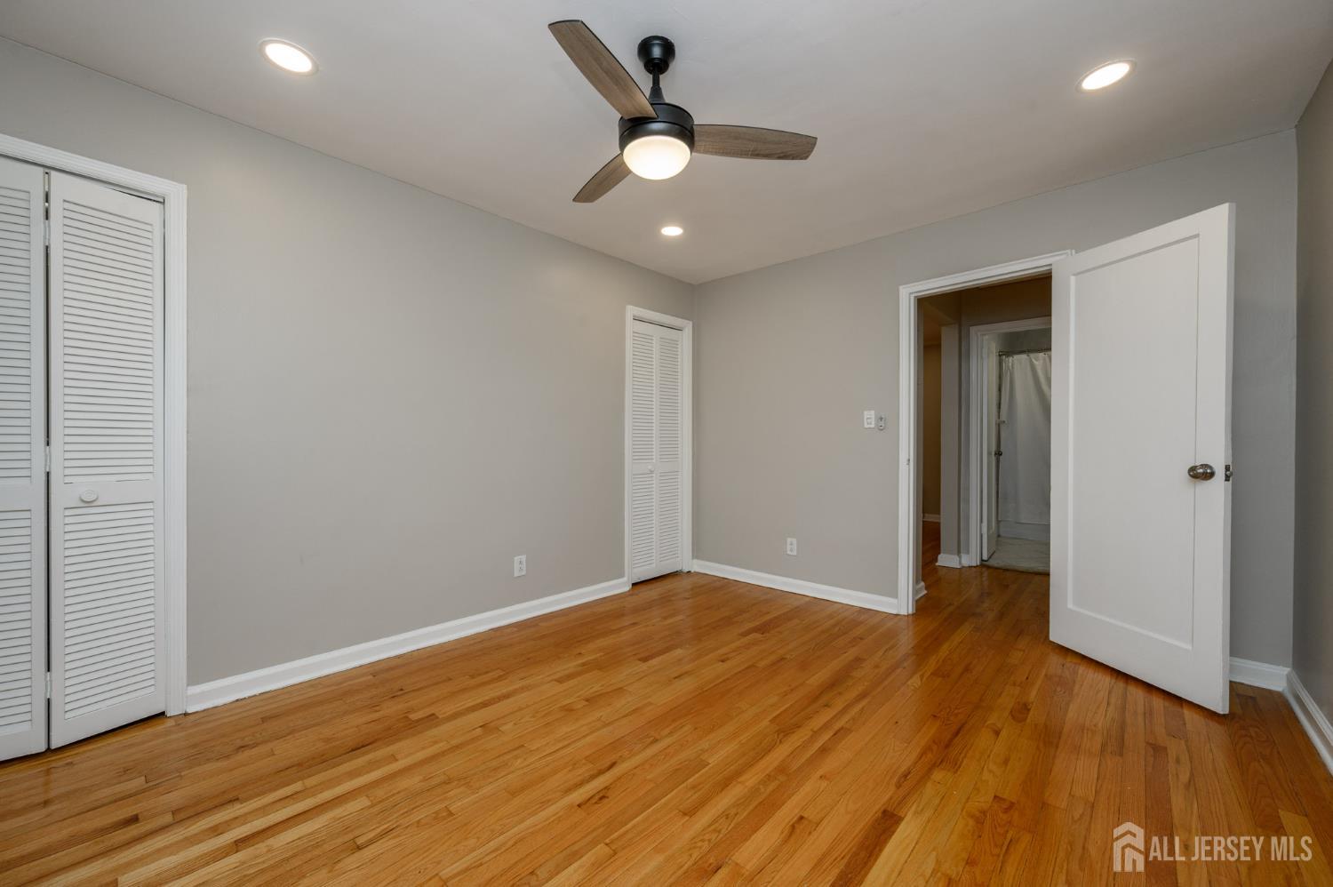 243 Johnson Avenue, Unit L5 Hackensack, NJ 07601 - Photo 16 of 24 wooden floor in an empty room with a window