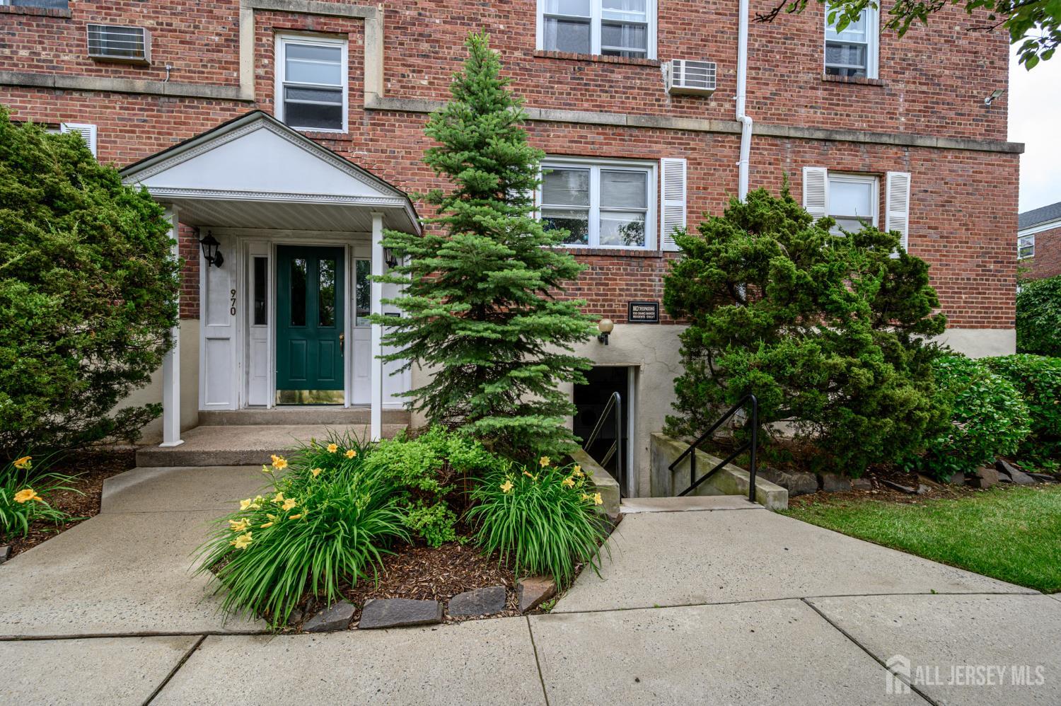 243 Johnson Avenue, Unit L5 Hackensack, NJ 07601 - Photo 20 of 24 front view of a brick house with a yard