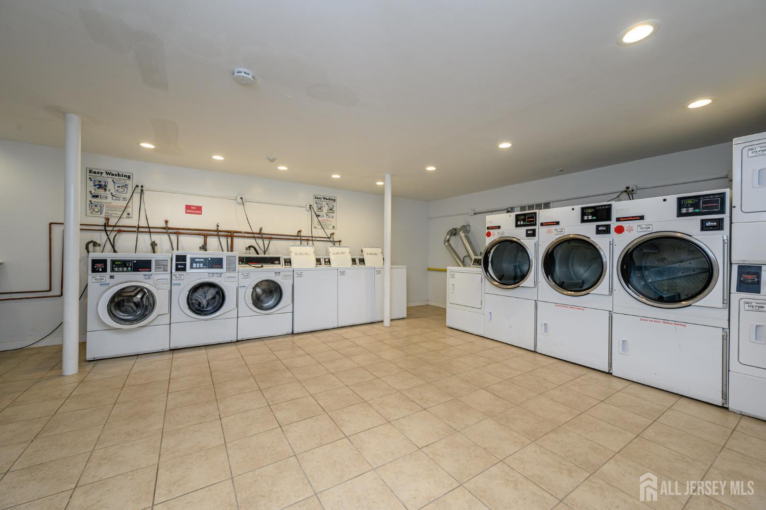 243 Johnson Avenue, Unit L5 Hackensack, NJ 07601 - Photo 22 of 24 a utility room with dryer and washer