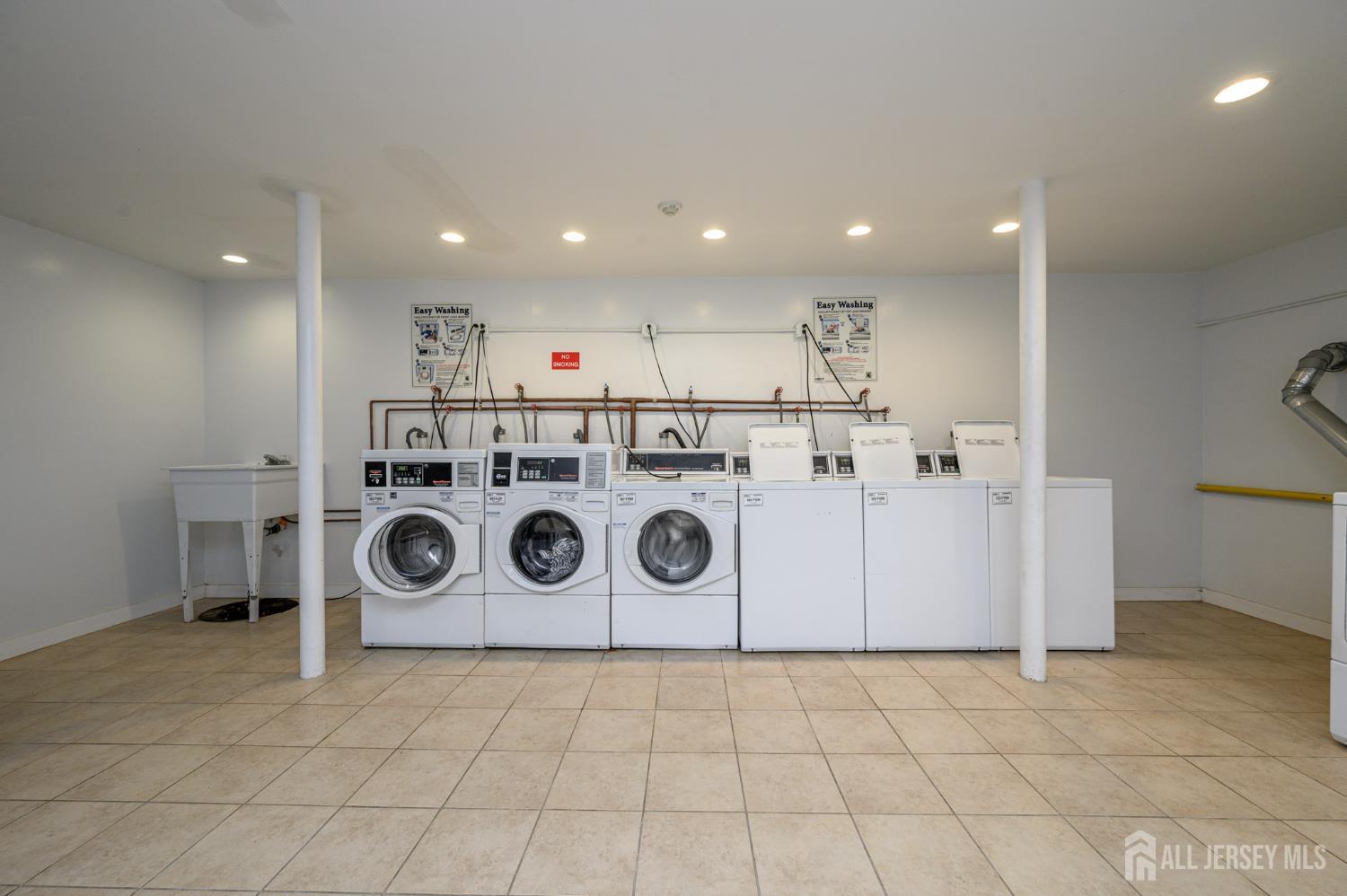 243 Johnson Avenue, Unit L5 Hackensack, NJ 07601 - Photo 23 of 24 a utility room with washer and dryer