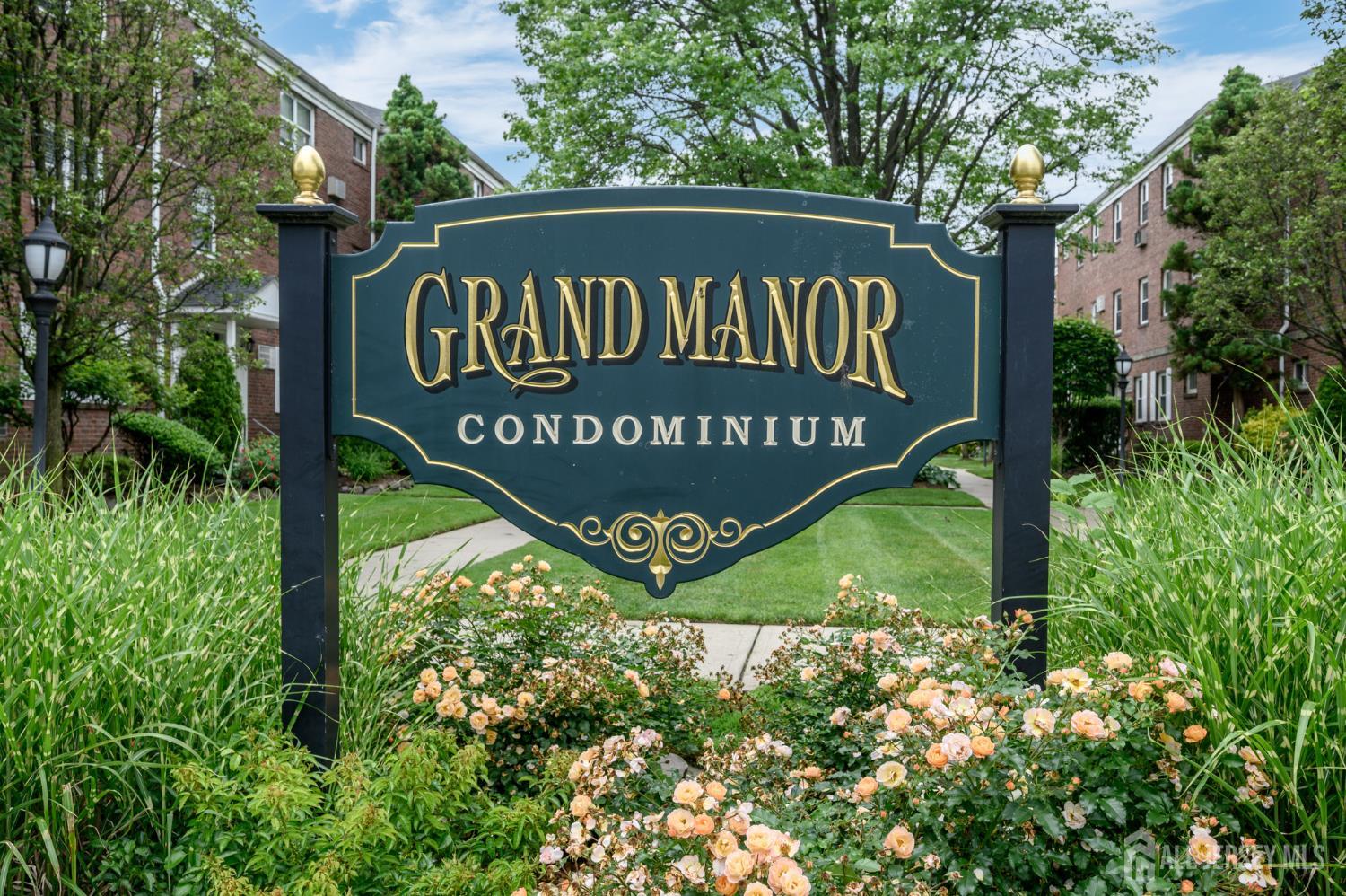 243 Johnson Avenue, Unit L5 Hackensack, NJ 07601 - Photo 24 of 24 a sign broad in front of flowers