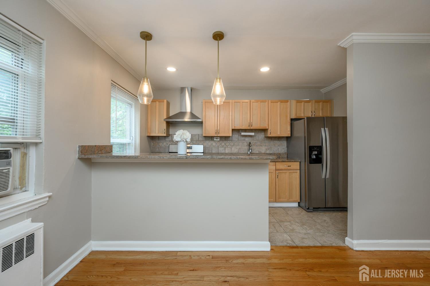 243 Johnson Avenue, Unit L5 Hackensack, NJ 07601 - Photo 10 of 24 a view of a kitchen with a sink and dishwasher refrigerator freezer