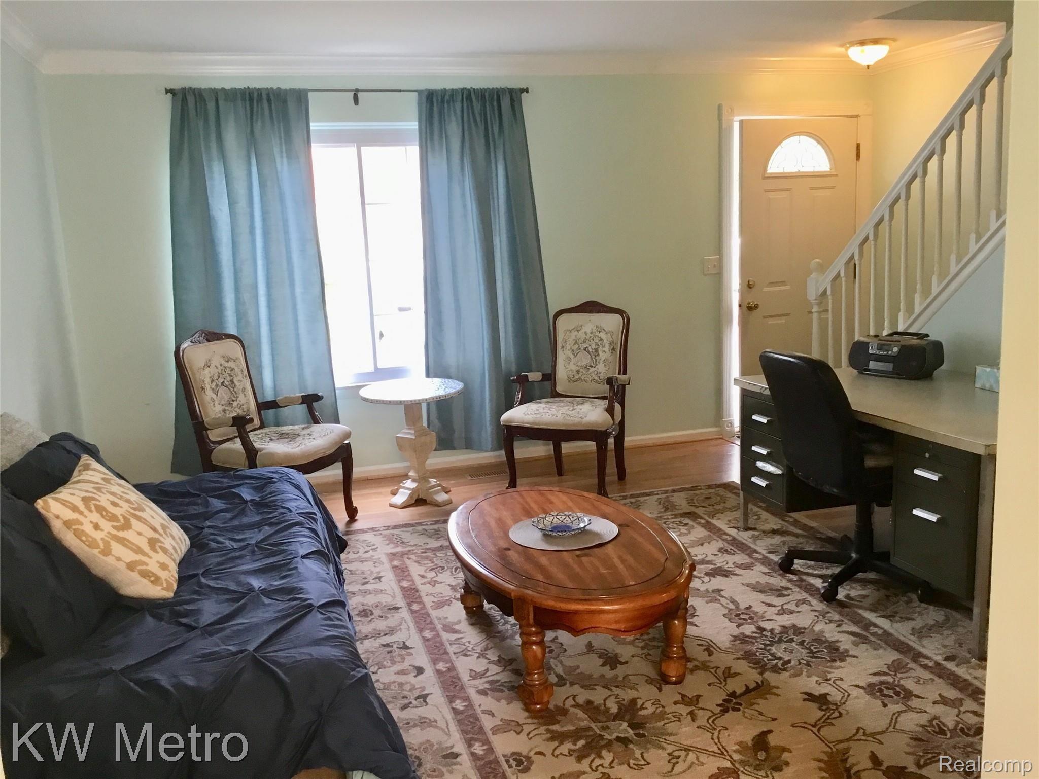 67976 Van Dyke Road, Unit 13 Washington, MI 48095 - Photo 7 of 23 Nice Size Living Room w/Crown Molding