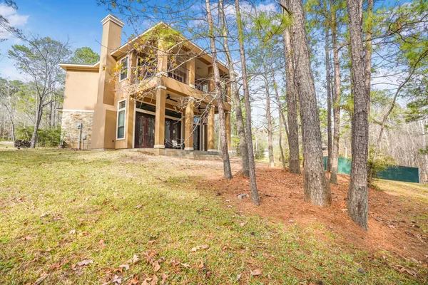 a view of a large building with large trees