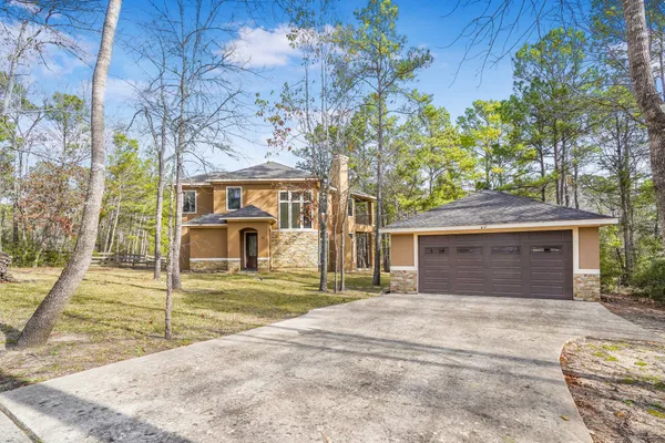 front view of a house with a yard