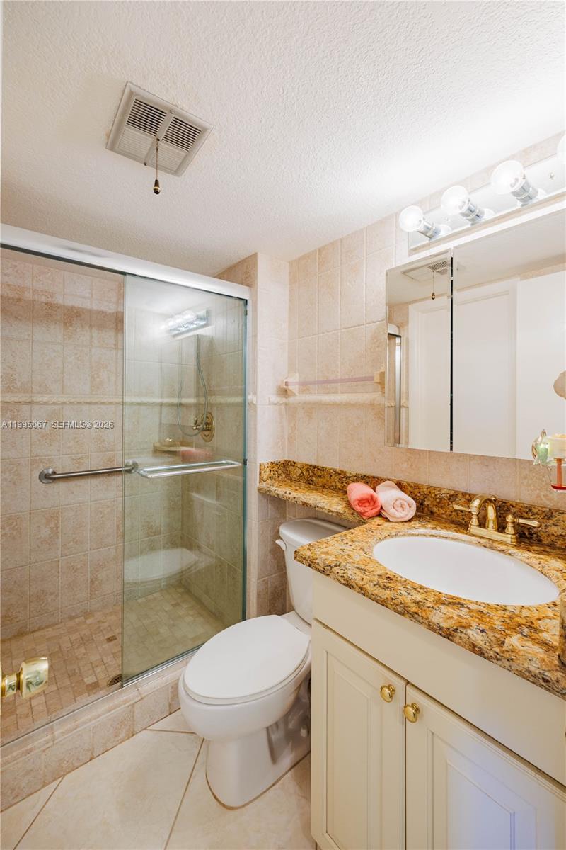 9150 Lime Bay Boulevard, Unit 110 Tamarac, FL 33321 - Photo 11 of 34 Guest Bathroom