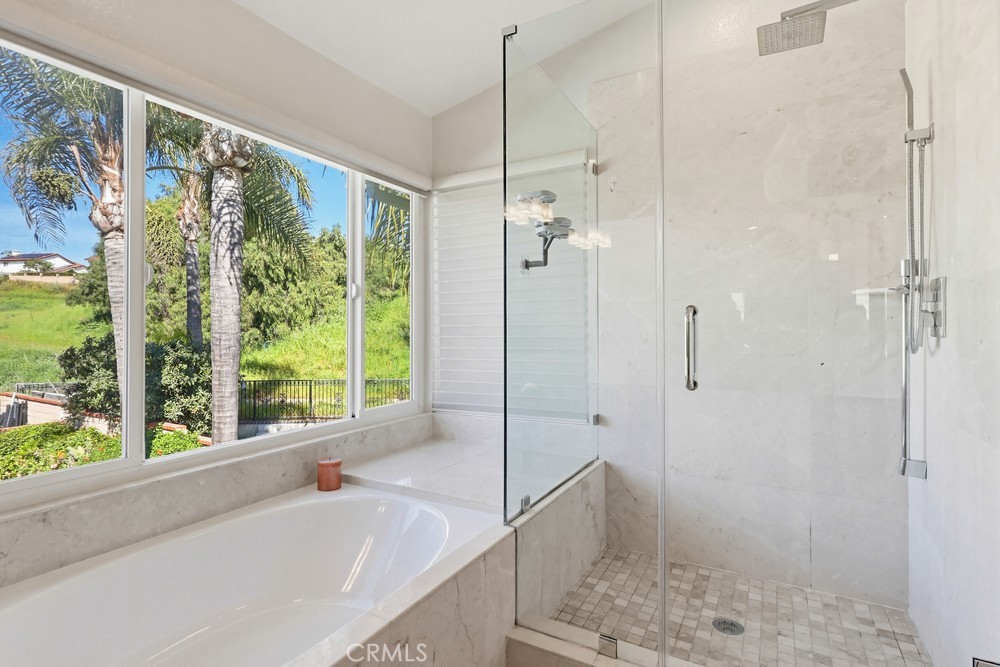 24303 East Rimford Place Diamond Bar, CA 91765 - Photo 18 of 39 a bathroom with a shower and a sink