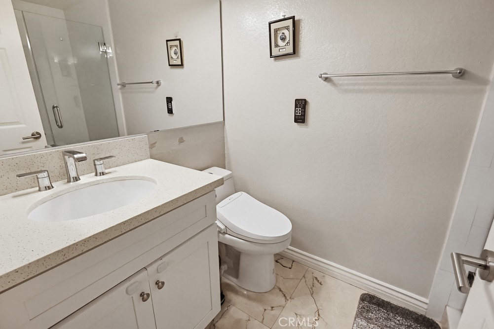 24303 East Rimford Place Diamond Bar, CA 91765 - Photo 27 of 39 a bathroom with a sink a toilet and shower
