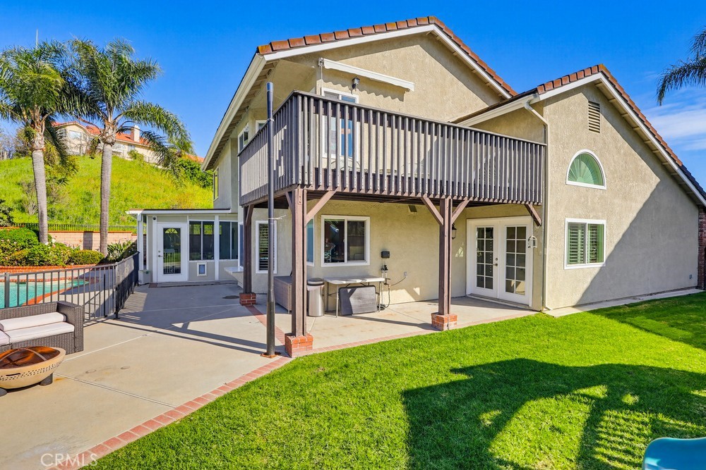 24303 East Rimford Place Diamond Bar, CA 91765 - Photo 32 of 39 a front view of a house with garden