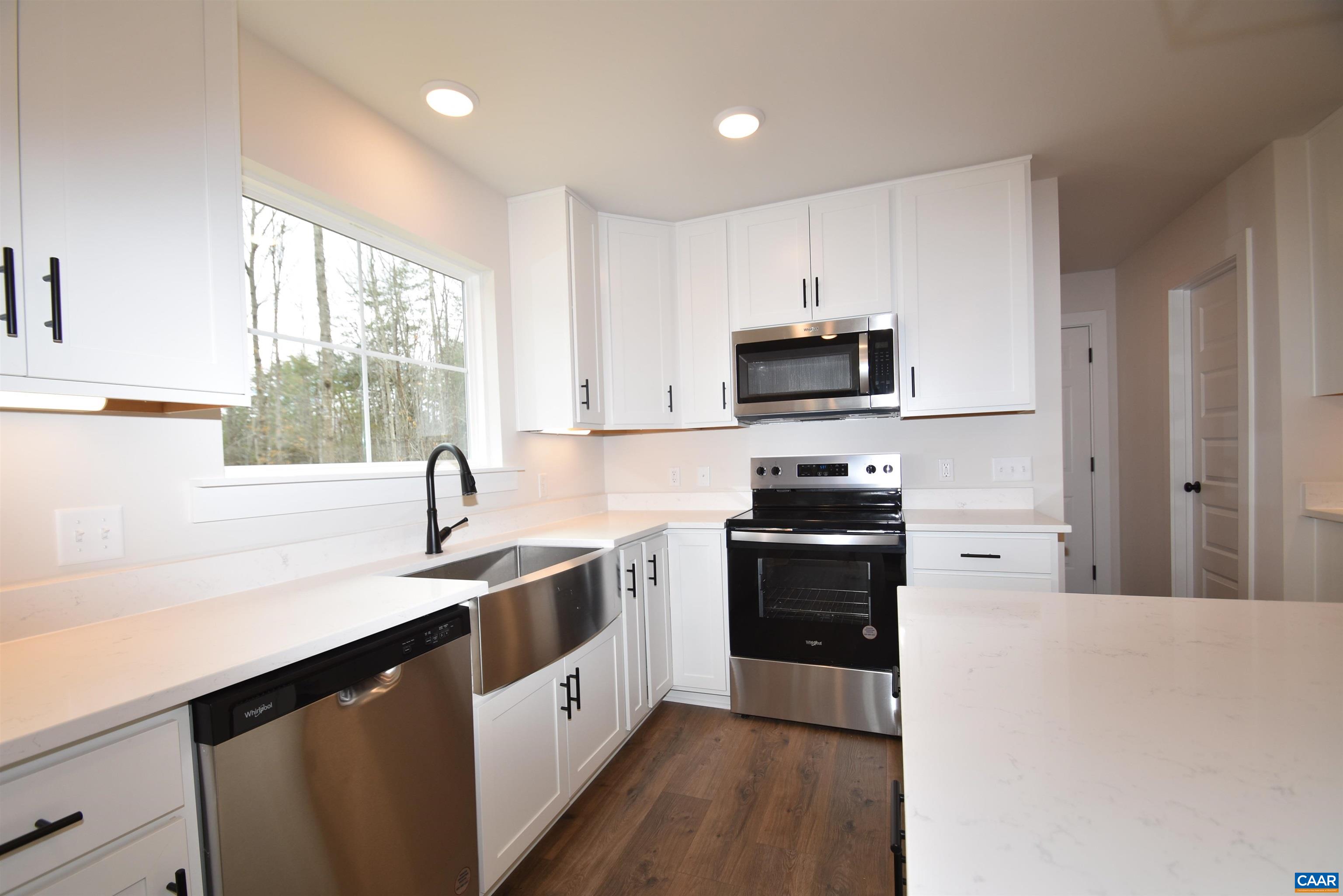 3 Chopt Road, Unit TC15B Kents Store, VA 23084 - Photo 11 of 33 a kitchen with stainless steel appliances granite countertop a sink stove and refrigerator