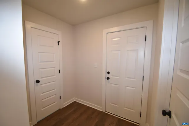 a balcony with wooden floor and fence