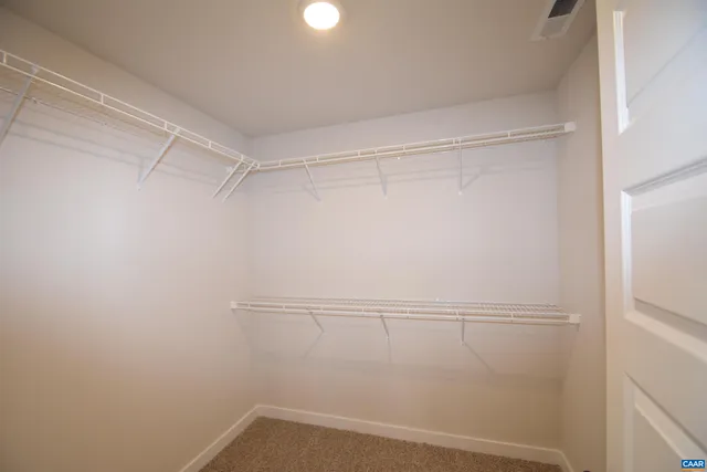 a view of a room with racks on the wall