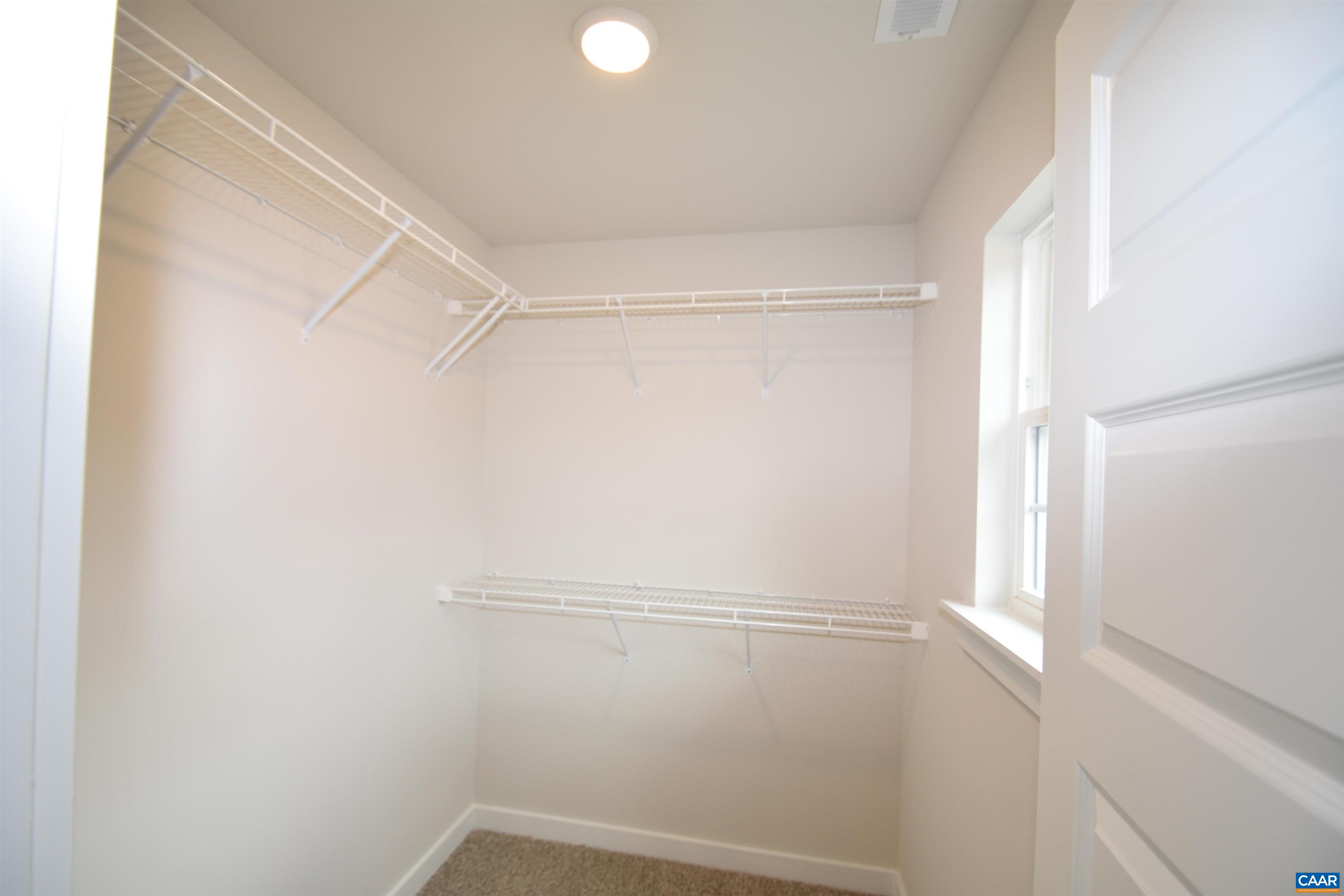 3 Chopt Road, Unit TC15B Kents Store, VA 23084 - Photo 21 of 33 a view of a room with racks on the wall