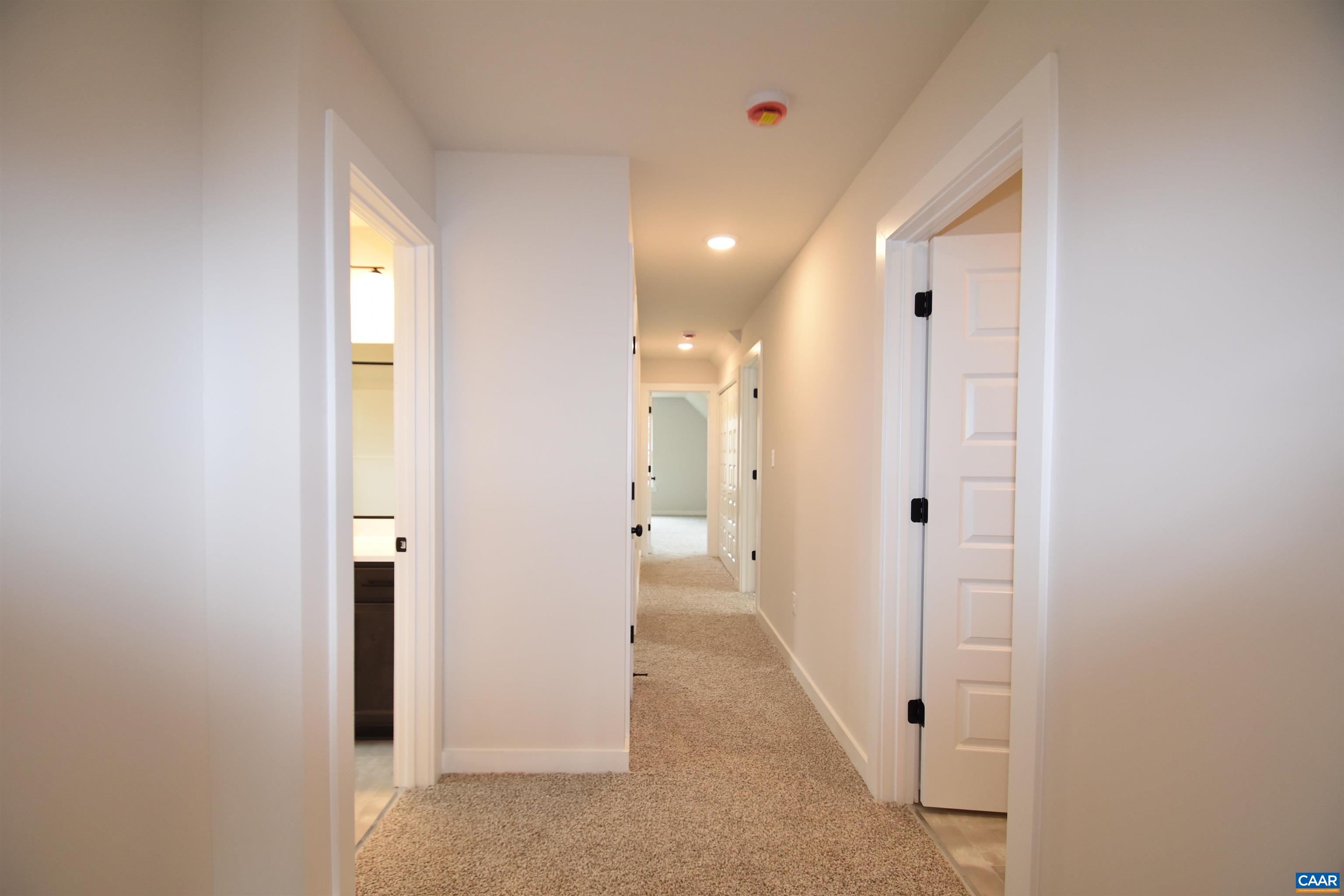 3 Chopt Road, Unit TC15B Kents Store, VA 23084 - Photo 22 of 33 a view of a hallway with wooden shelves