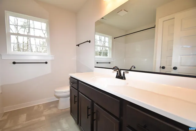 a bathroom with a shower and a bath tub