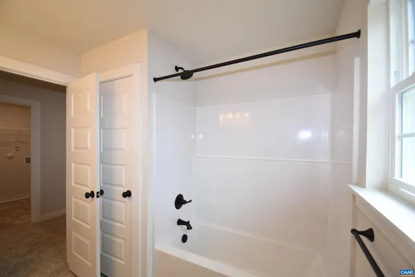 a view of a room with shelf on the wall