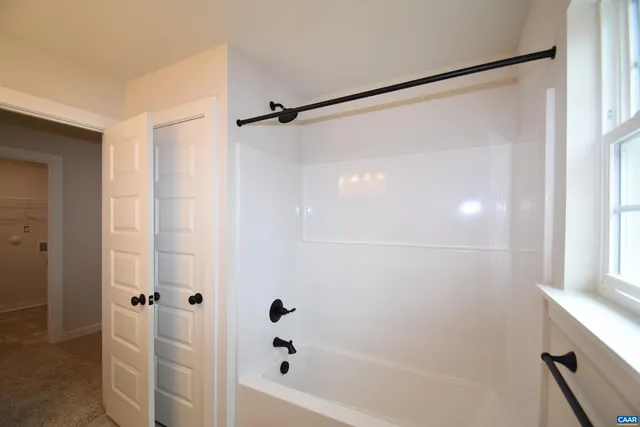 a view of a room with shelf on the wall