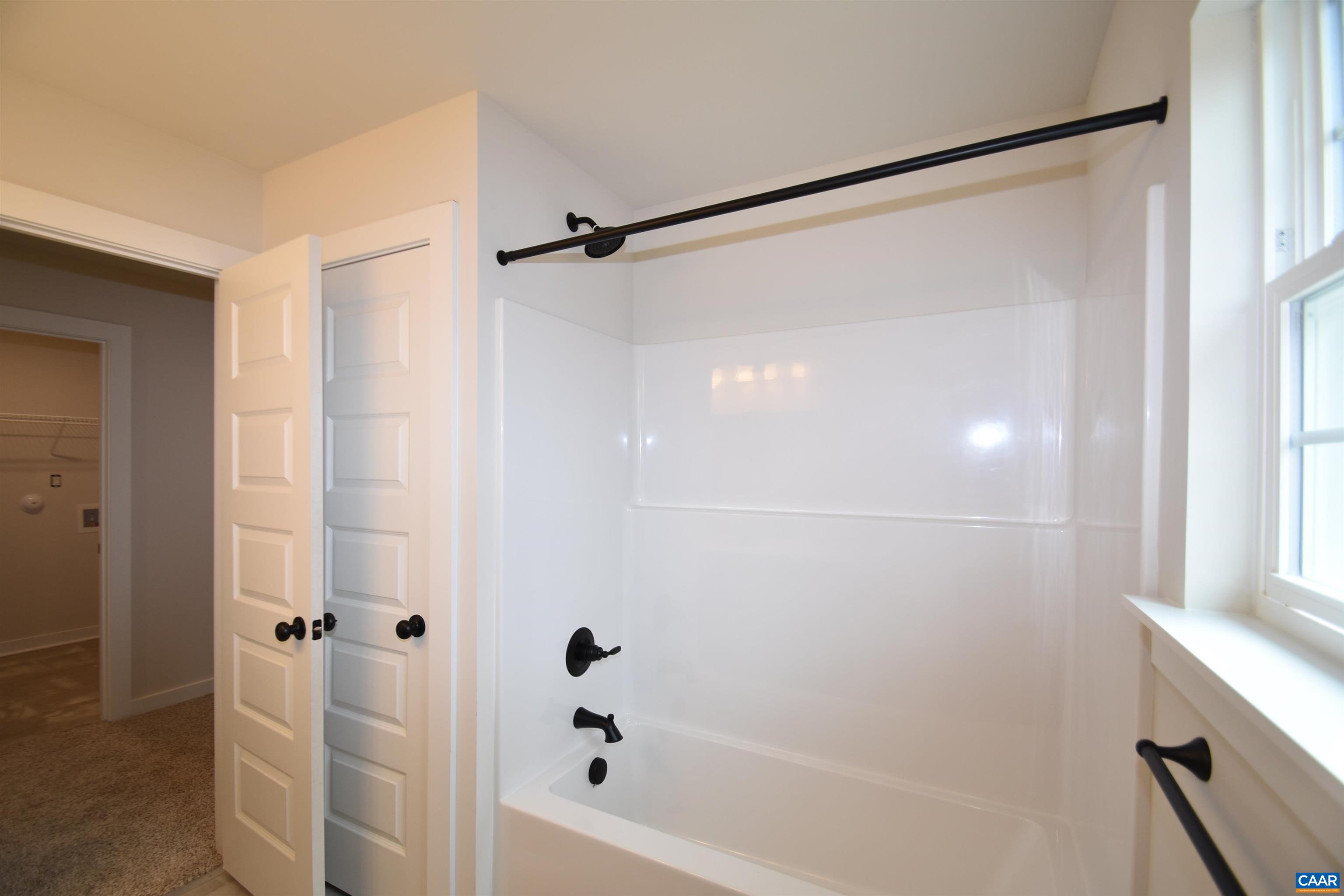 3 Chopt Road, Unit TC15B Kents Store, VA 23084 - Photo 24 of 33 a bathroom with a shower and a bath tub