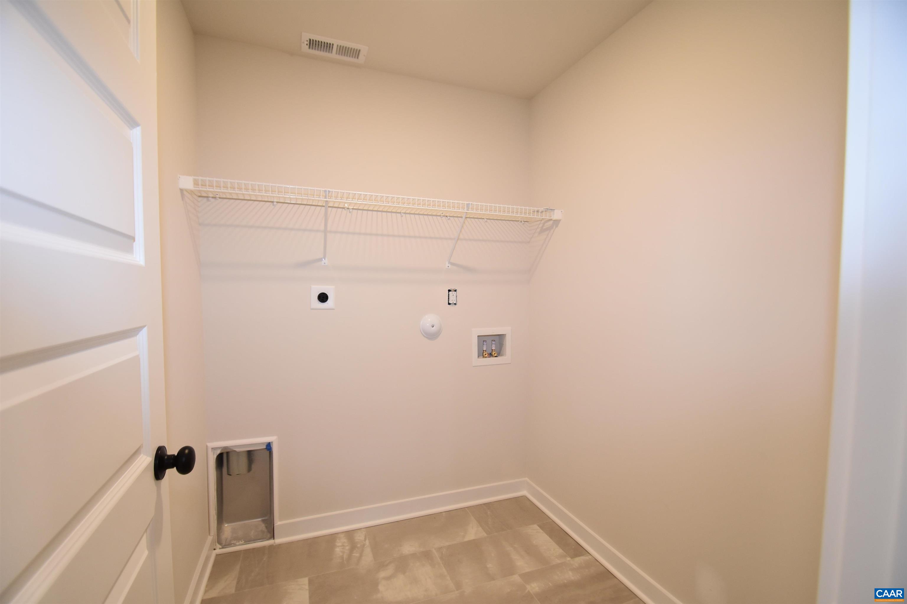 3 Chopt Road, Unit TC15B Kents Store, VA 23084 - Photo 25 of 33 a view of a room with shelf on the wall