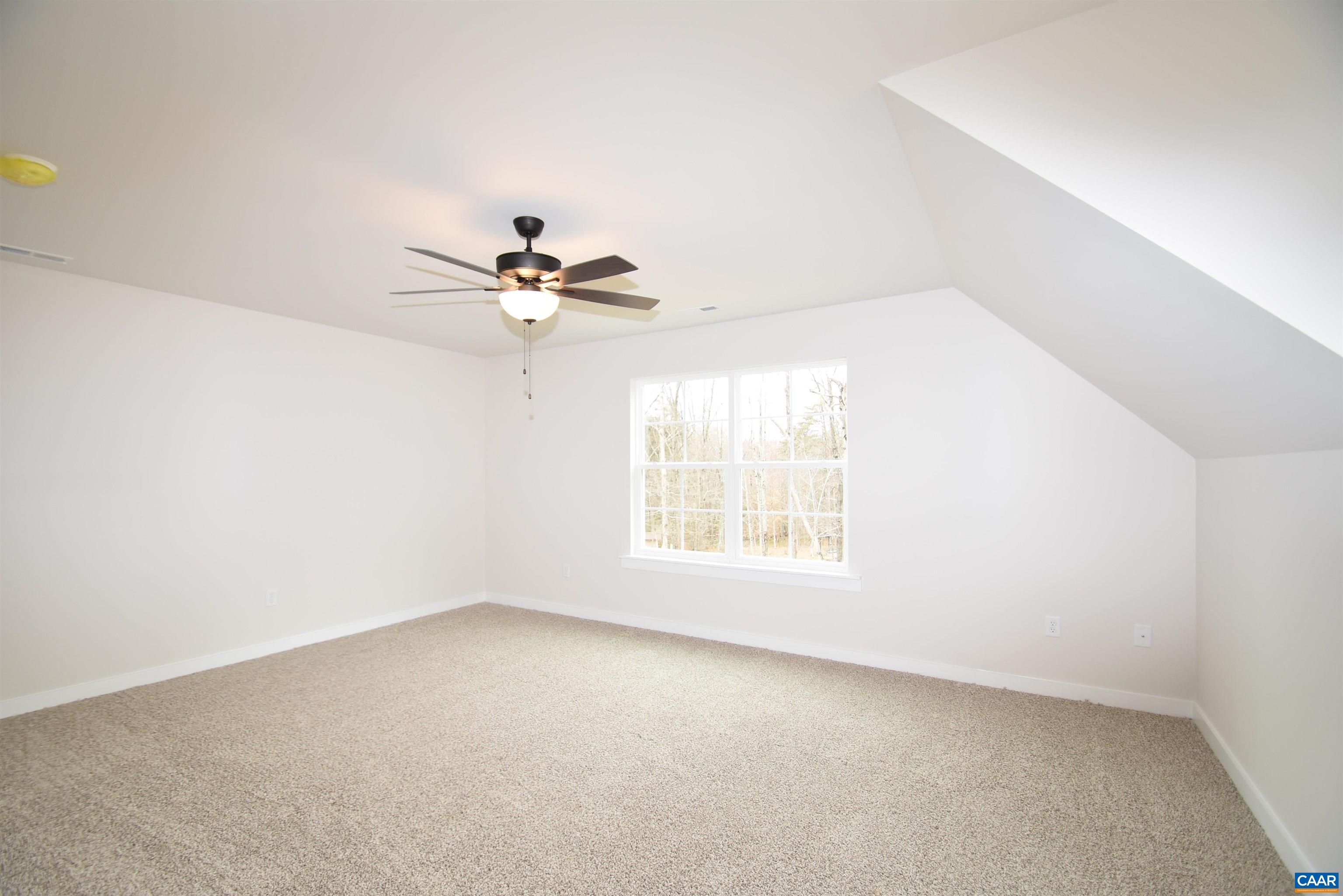 3 Chopt Road, Unit TC15B Kents Store, VA 23084 - Photo 28 of 33 an empty room with a window and a ceiling fan