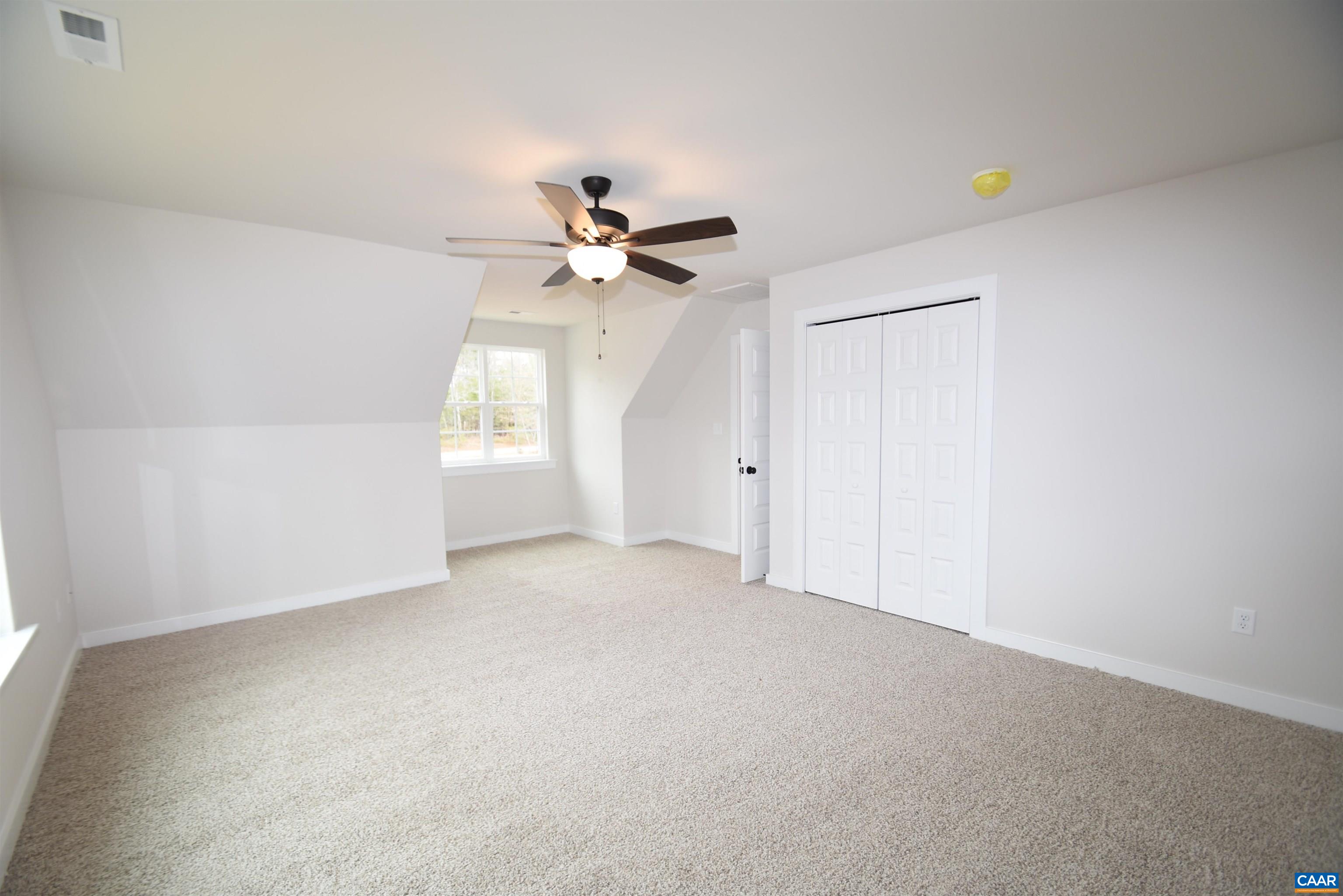 3 Chopt Road, Unit TC15B Kents Store, VA 23084 - Photo 30 of 33 a view of a livingroom with a ceiling fan and window