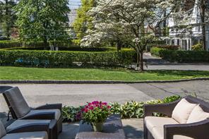 a view of a chair and table in the garden and sitting area