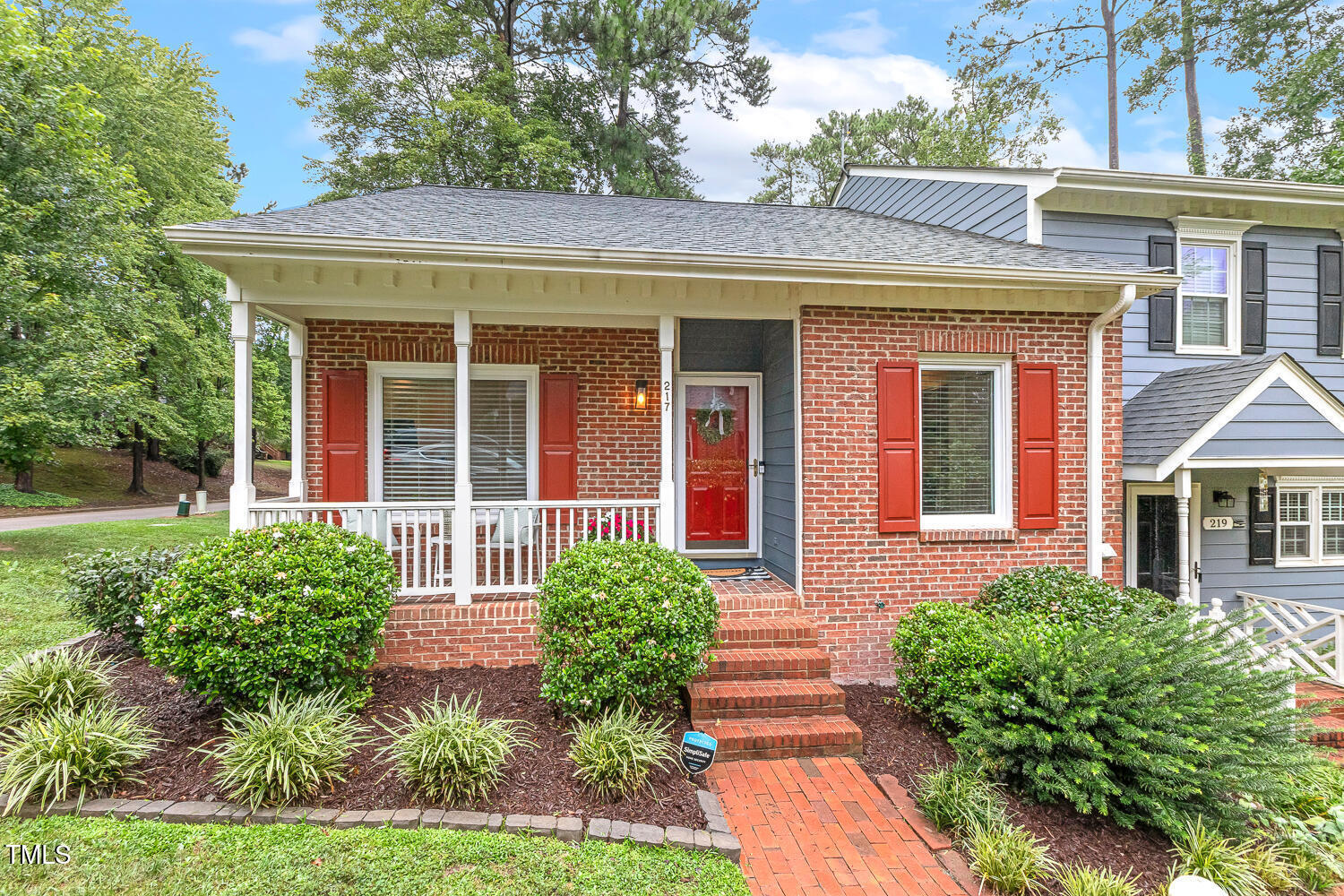 217 Danforth Drive Cary, NC 27511 - Photo 1 of 40 front view of a brick house with a yard