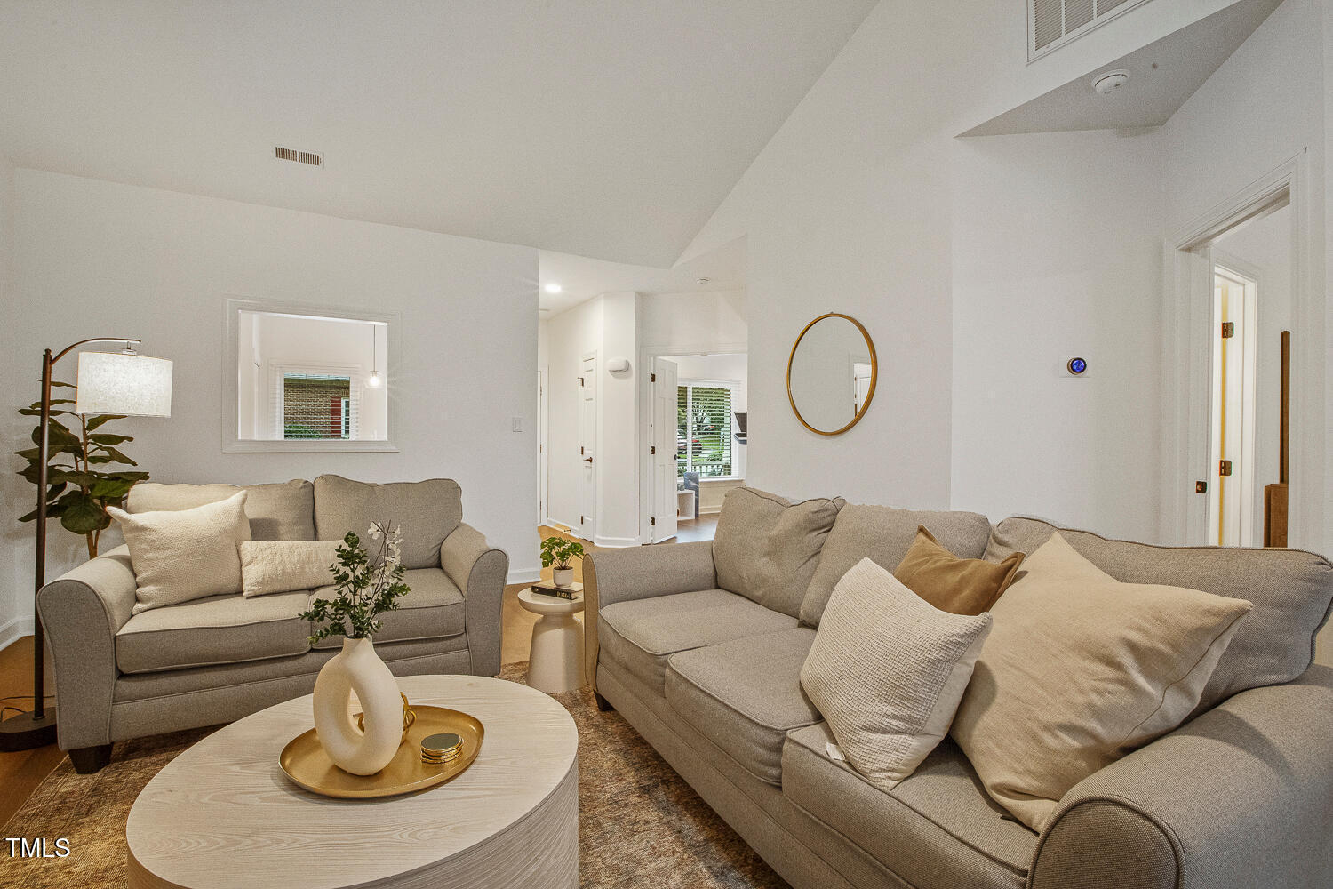 217 Danforth Drive Cary, NC 27511 - Photo 13 of 40 a living room with furniture a rug and a table